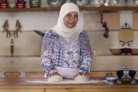 Lebanese cancer foundation - woman kneading dough