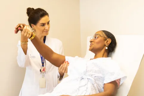 Black woman examined by a female doctor for breast cancer