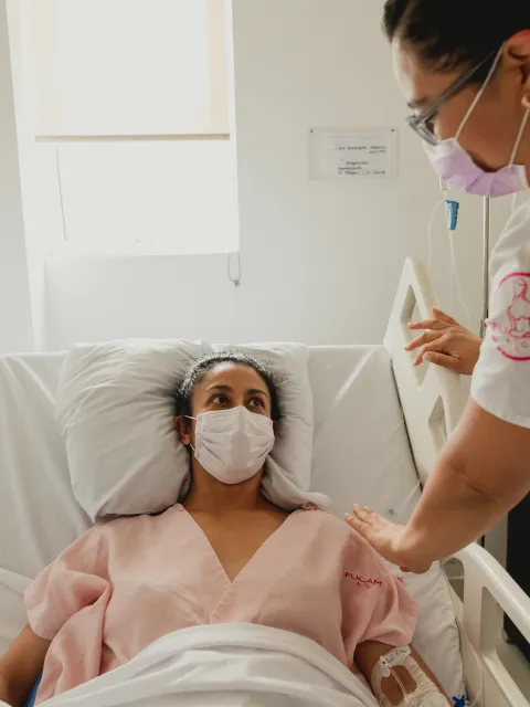 Nurse taking care of a patient in Mexico - FUCAM